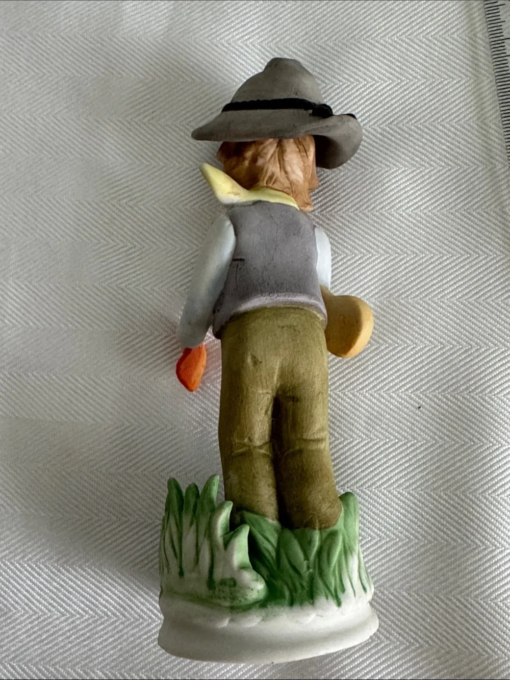 Hand-Painted Porcelain Boy Figurine in Neutral and Orange
